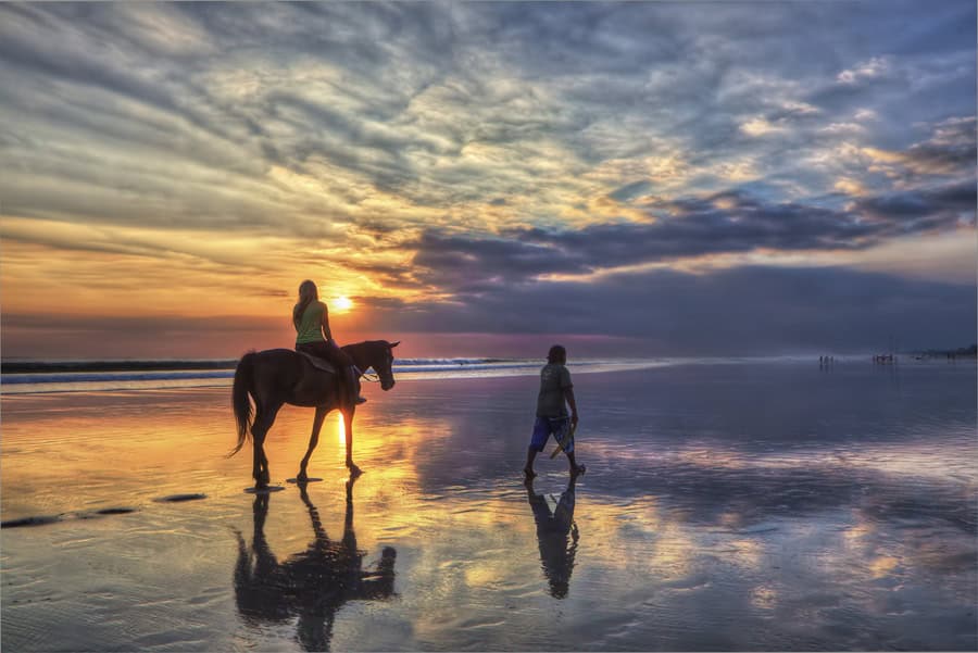 Horse riding at sunset 