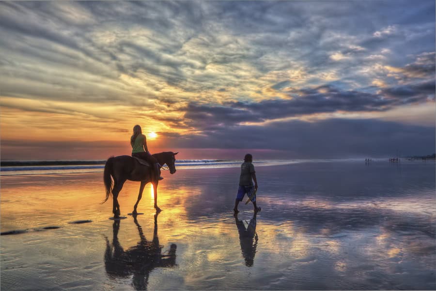 Horse riding at sunset