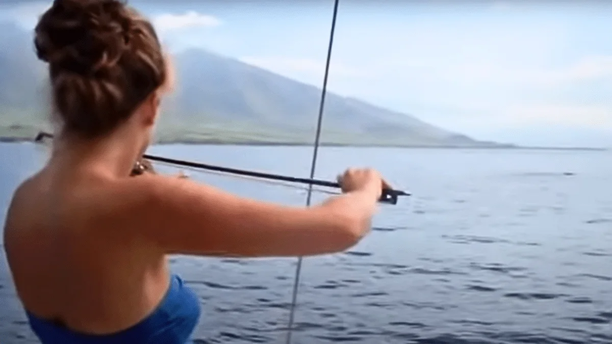 women plays violin for whales