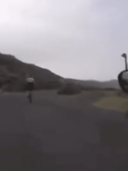 Angry Ostrich Chases Two Cyclists