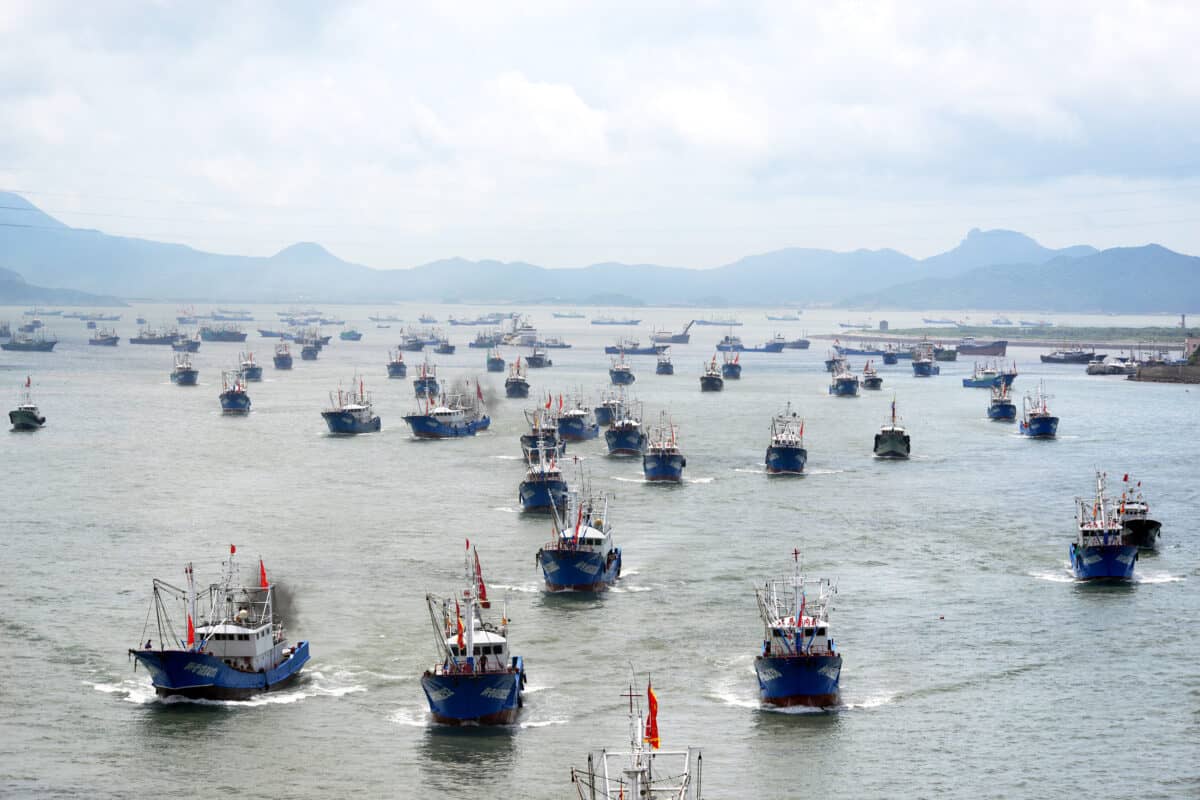A fishing fleet departs from a harbor after the summer fishing moratorium ended in Zhoushan city, east China's Zhejiang province, 1 August 2016