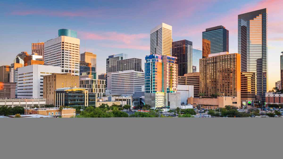 Houston, Texas, USA downtown park and skyline at twilight. Image by sepavone via Depositphotos.