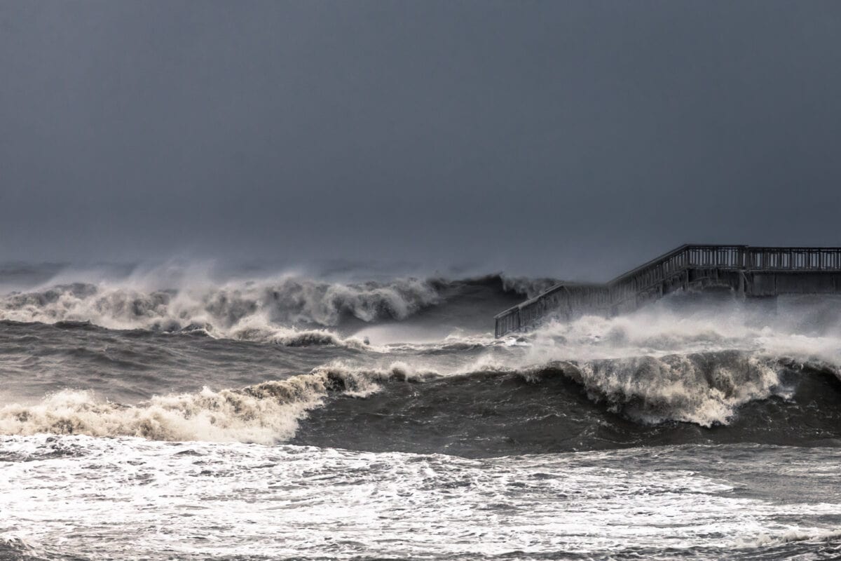Unusual enormous waves are smashing in the Burgas bridge in a winter storm.