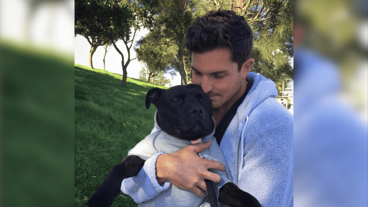 Adopted dog and owner wearing matching clothes.