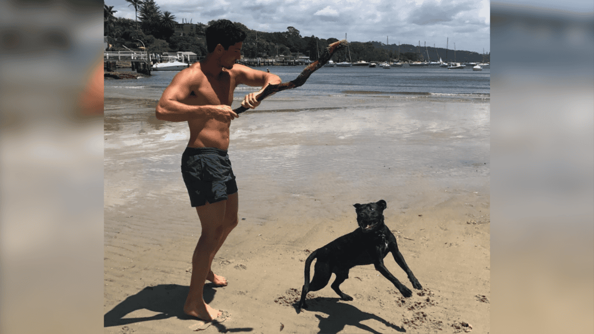 Adopted Pit Bull and dad at the beach.