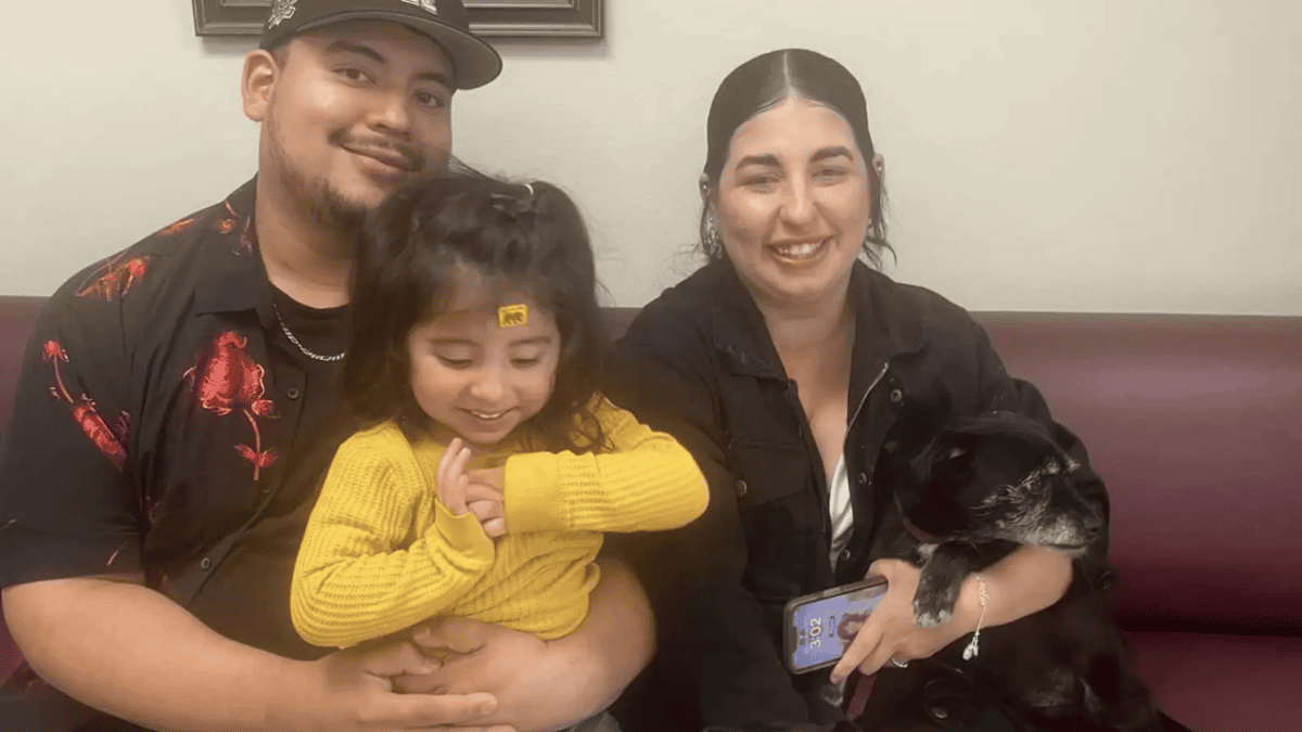 Marley's family holding him, grateful to have him back.