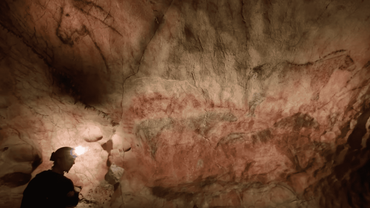 Cave painting with person for perspective.