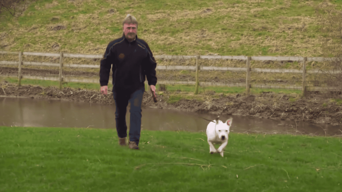 Special bond between abandoned dog, Snoop, and new owner, Laurence.