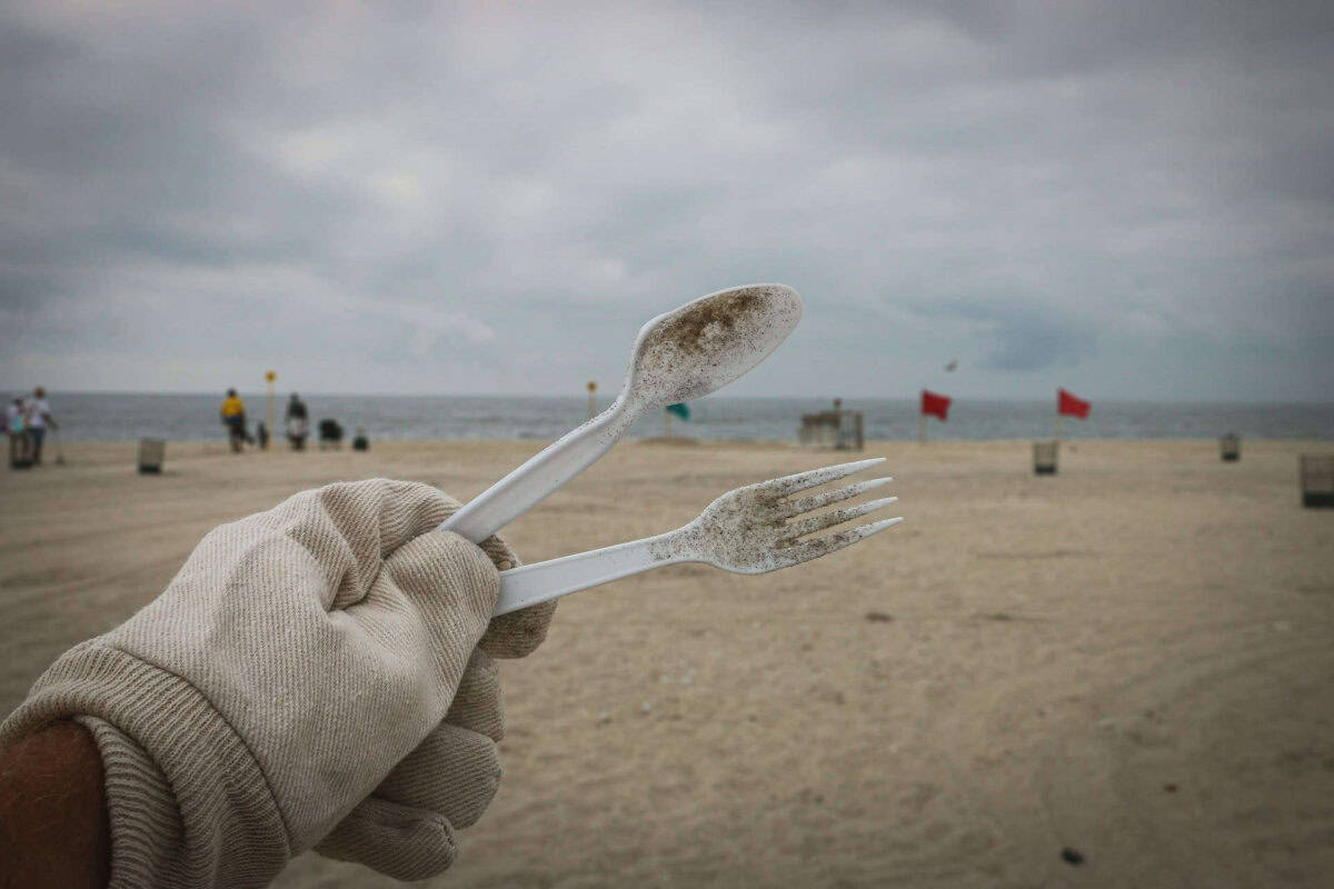 collecting palstic on a beach