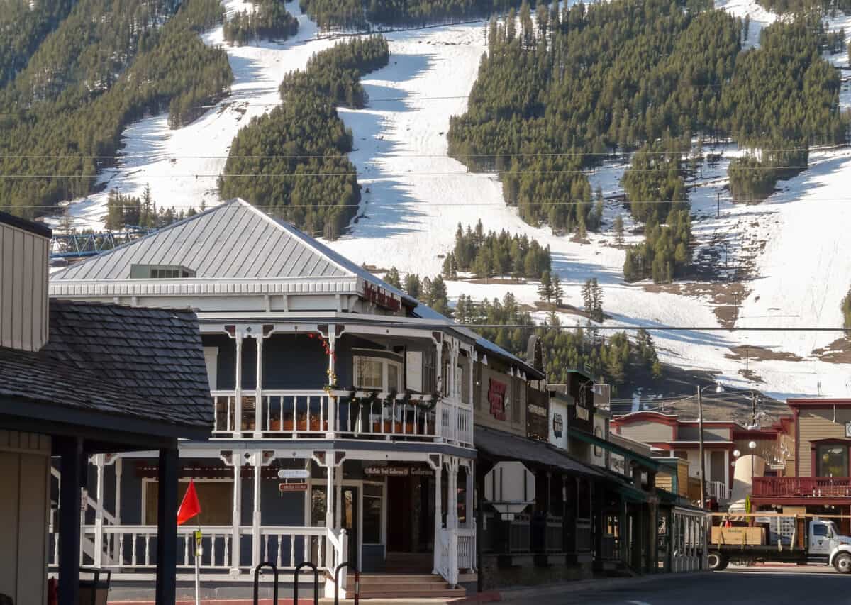 Streets of Jackson Hole with ski slopes at background