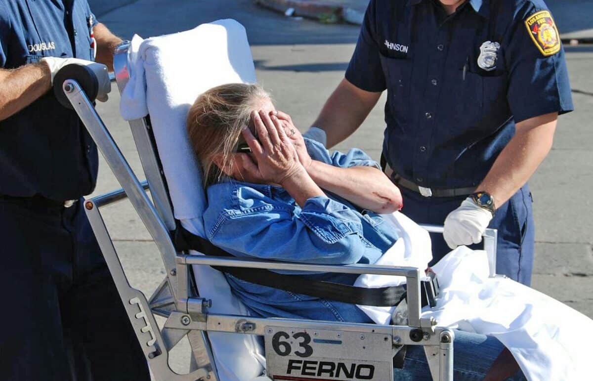 Ambulance crew assists a distressed woman during an emergency in Los Angeles.