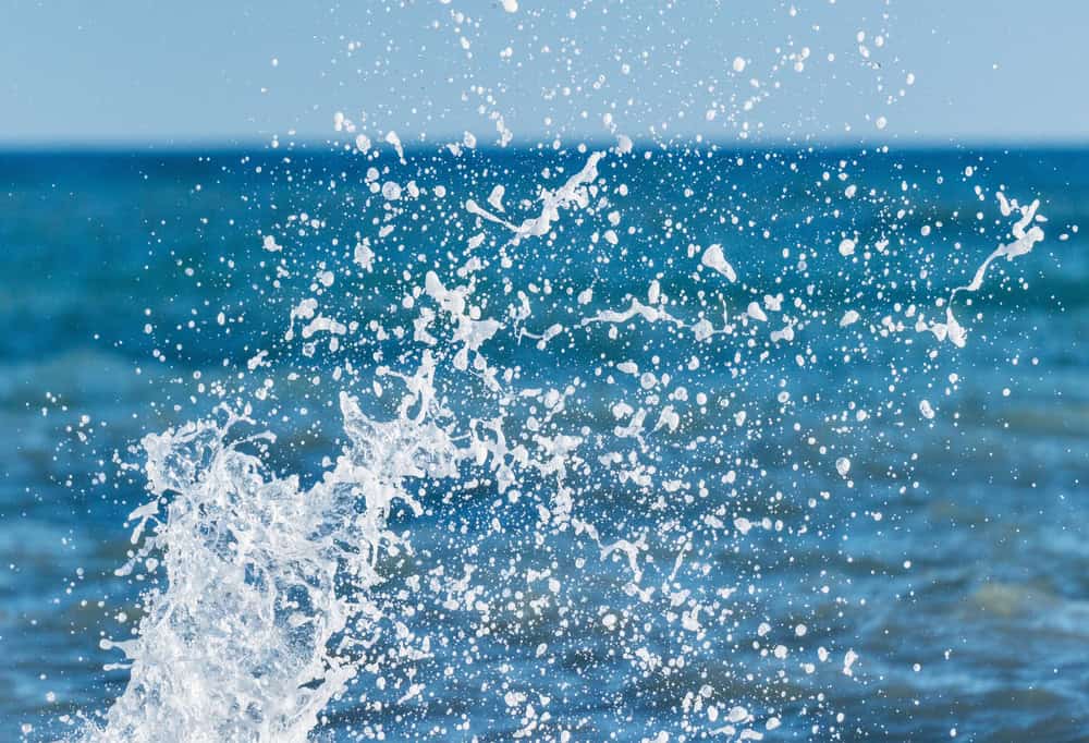 Wave of the sea water at sunny day time