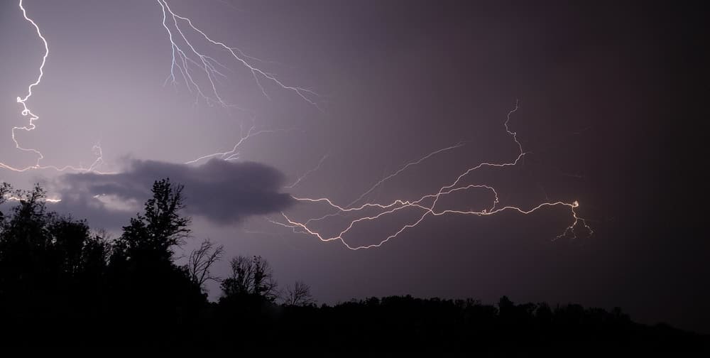 Lightning bolts reflection over the sea