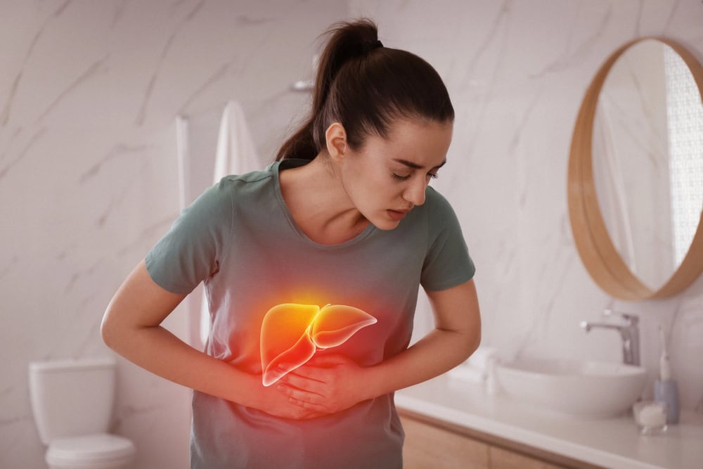 Women suffering from liver pain. 