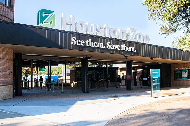 The welcoming entrance of Houston Zoo, emphasizing wildlife conservation with its motto, 'See them. Save them.