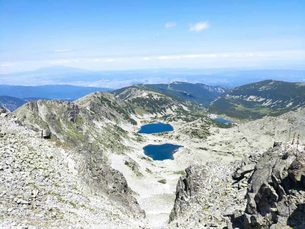 Stunning aerial shot of Musalenski Ezera lakes amidst the scenic Rila Mountain range in Bulgaria.