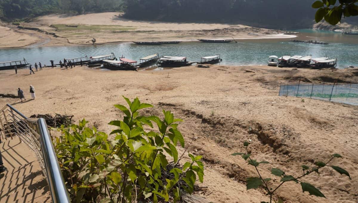 A bunch of boats that are sitting in the sand