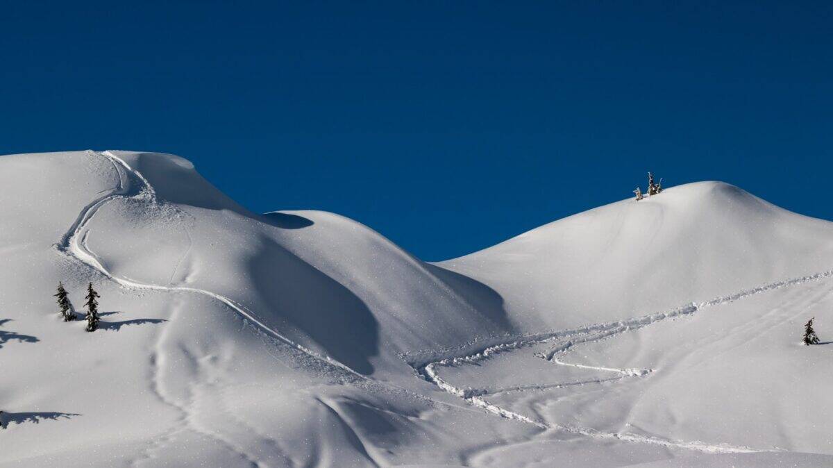 aerial photography of snow covered hills