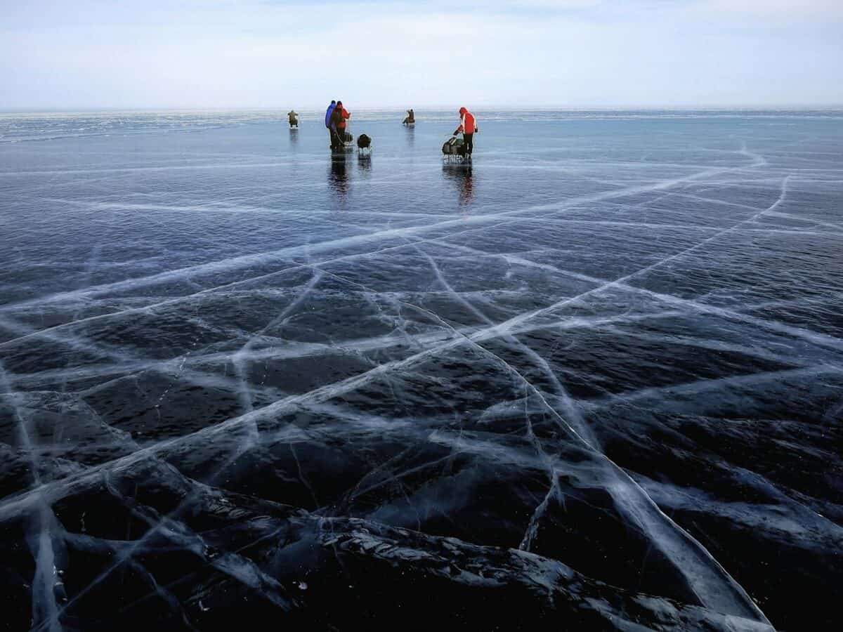 Explore a winter wonderland on the frozen surface of Lake Baikal, Russia.