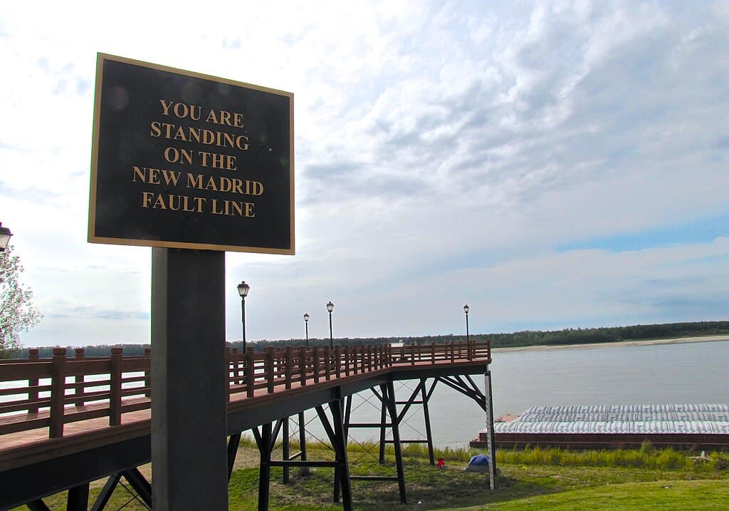 Sign referencing the New Madrid Fault Line in New Madrid, Missouri, United States. The Mississippi River is in the background.