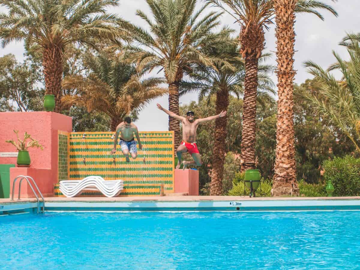 Men enjoying the ambiance of the pool.