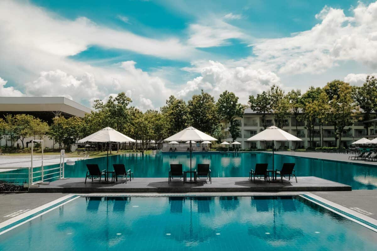 A beautiful resort surrounded by trees and villas.