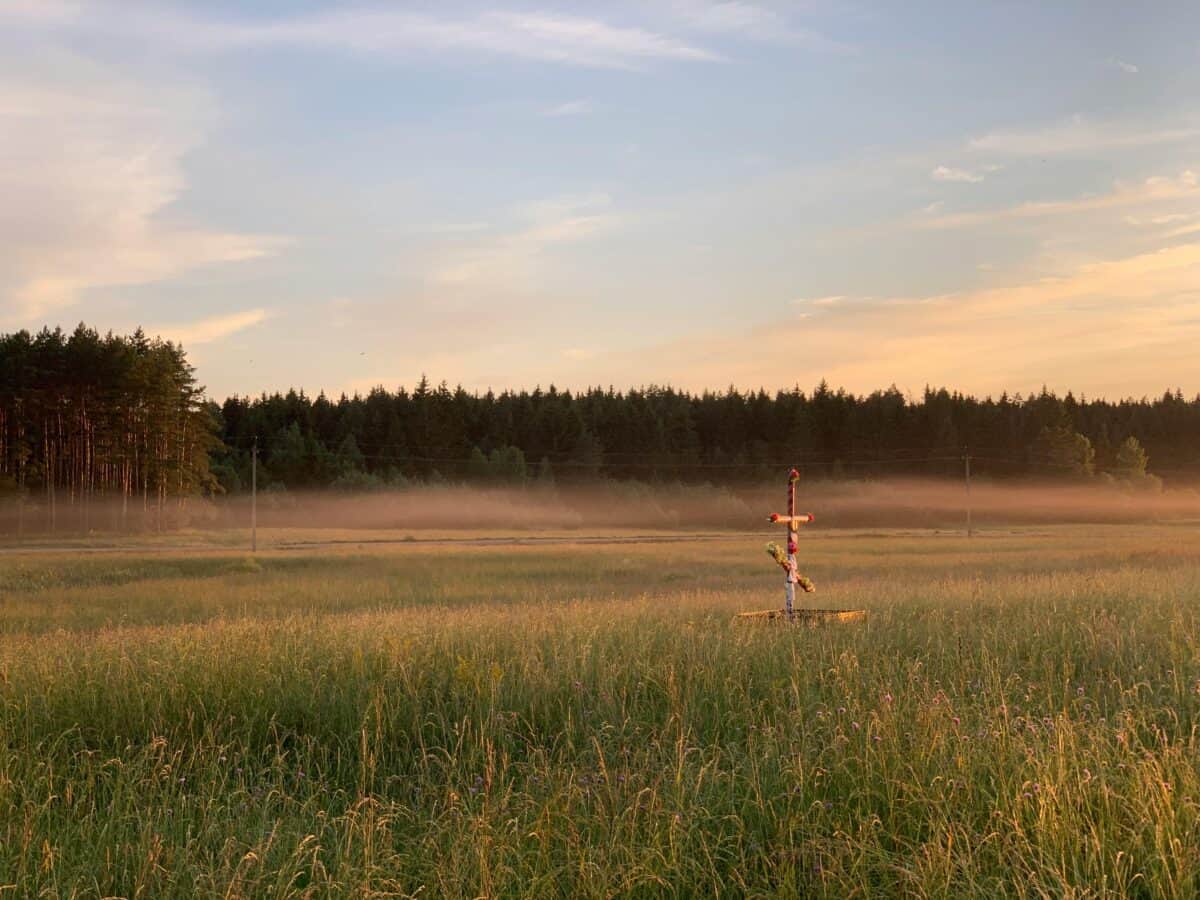A simple scarecrow on the field.