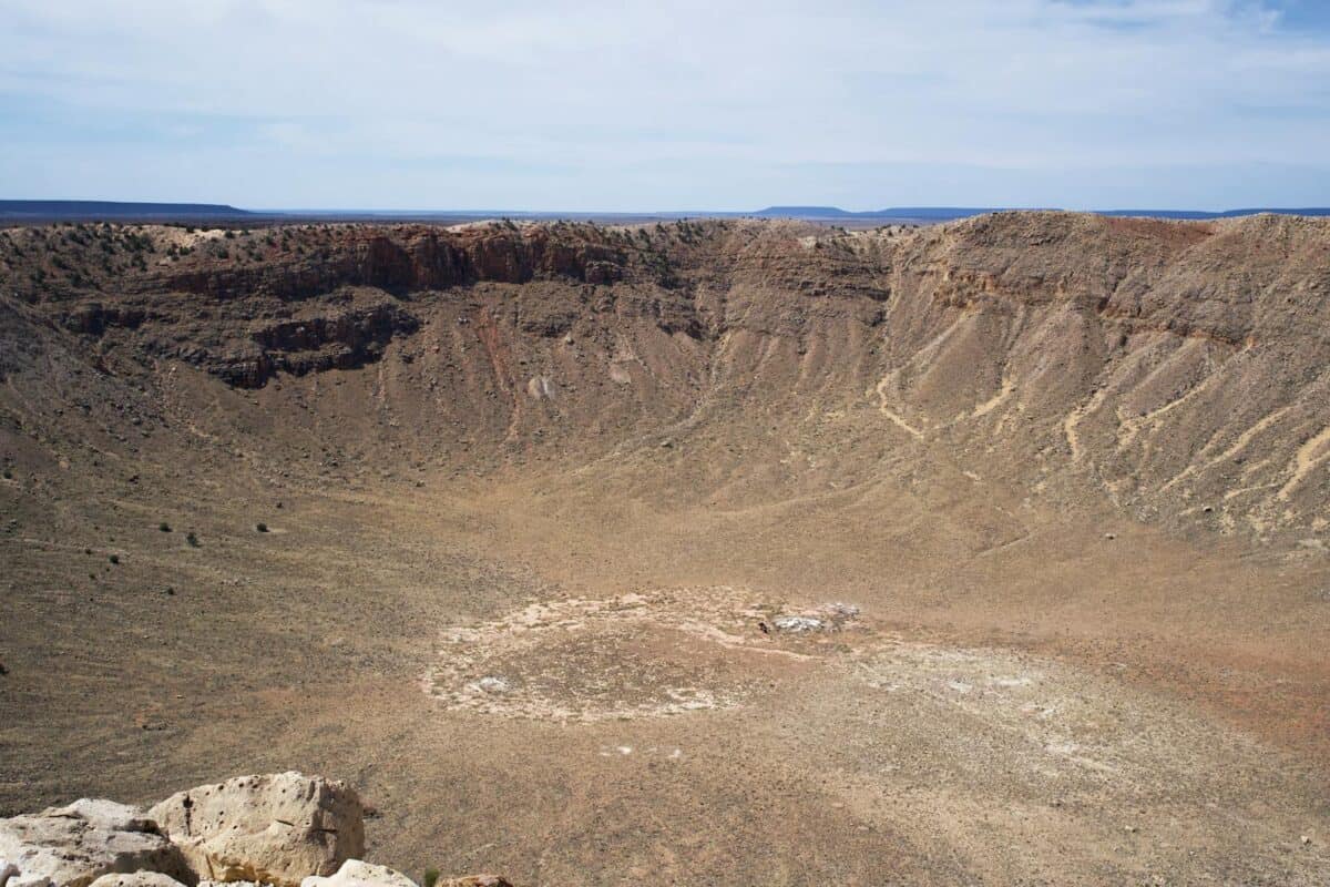 Panoramic view of Meteor Crater in Winslow, Arizona under a clear sky.