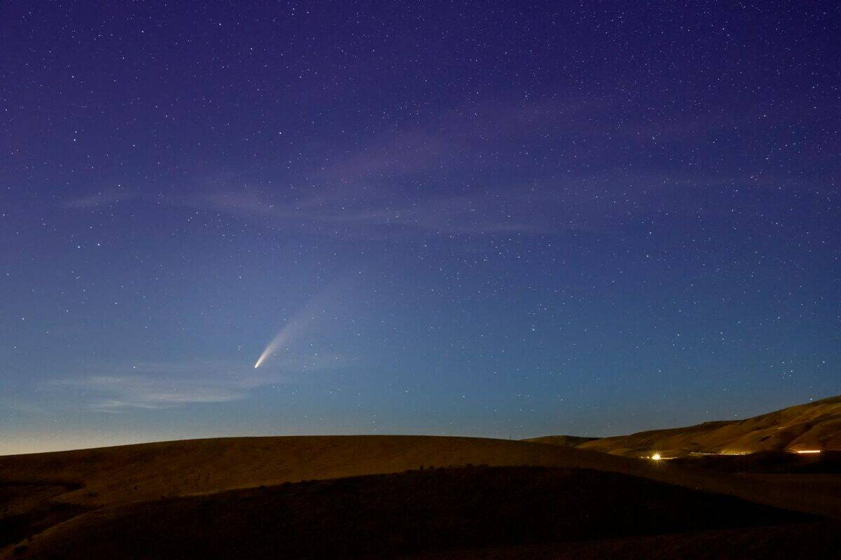 Beautiful night sky with a comet over the hills in Wenatchee, Washington. Perfect astrophotography capture.