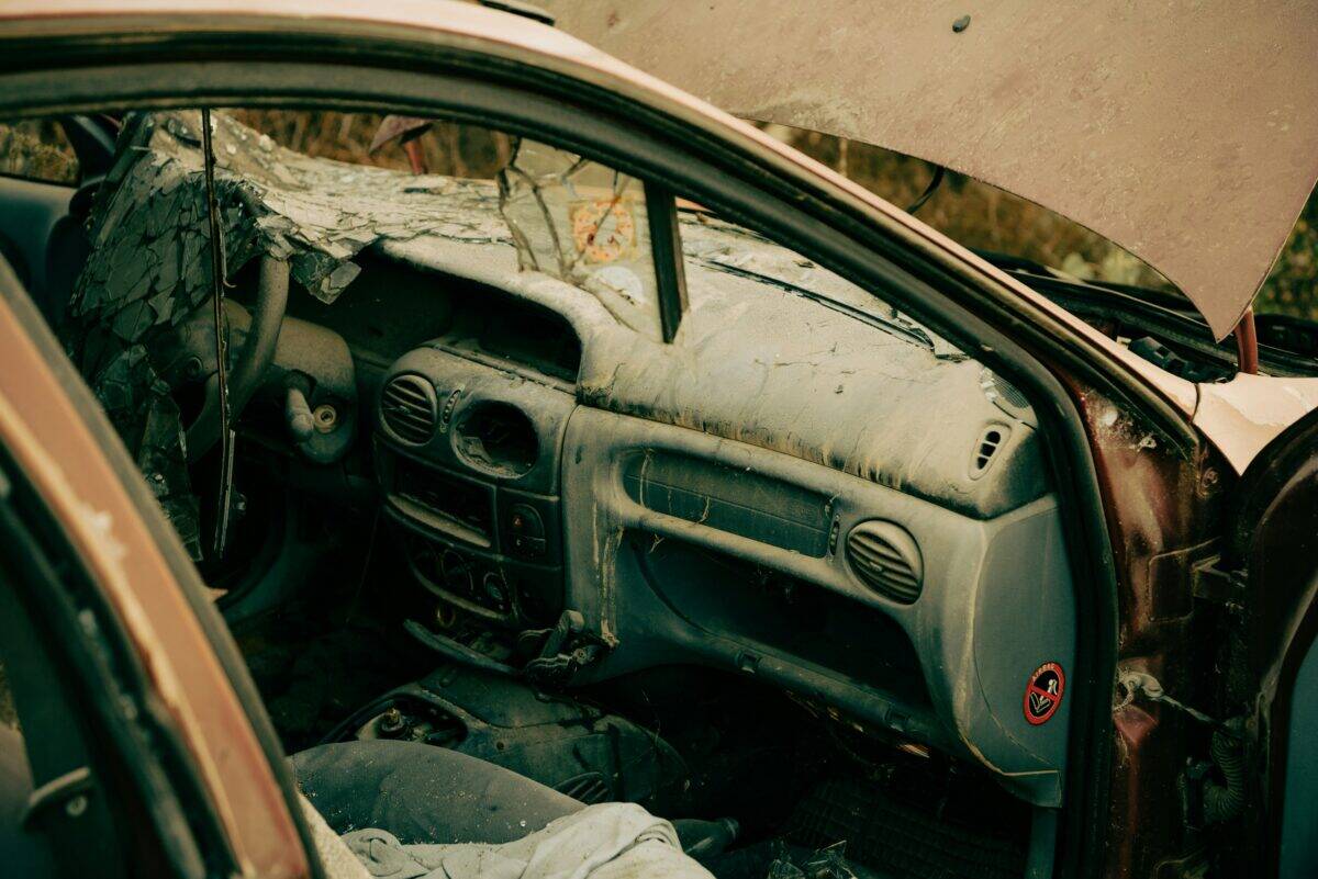 The interior of a totally destroyed car.