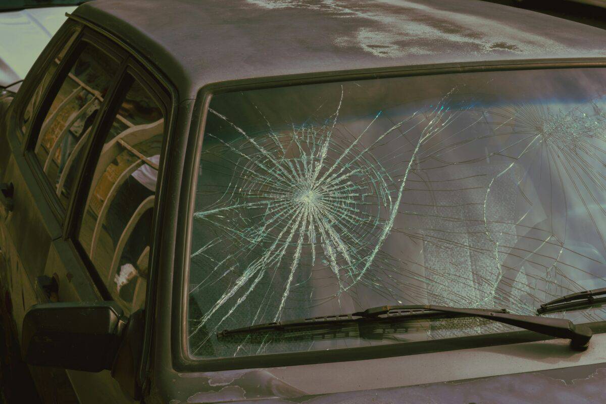 A car with a broken windshield.