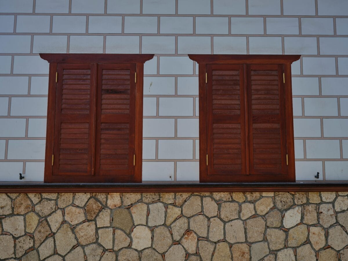 A photo of wooden windows closed.