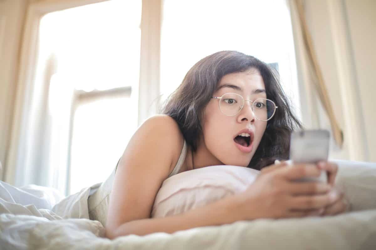 A woman was surprised after viewing something on her smartphone.