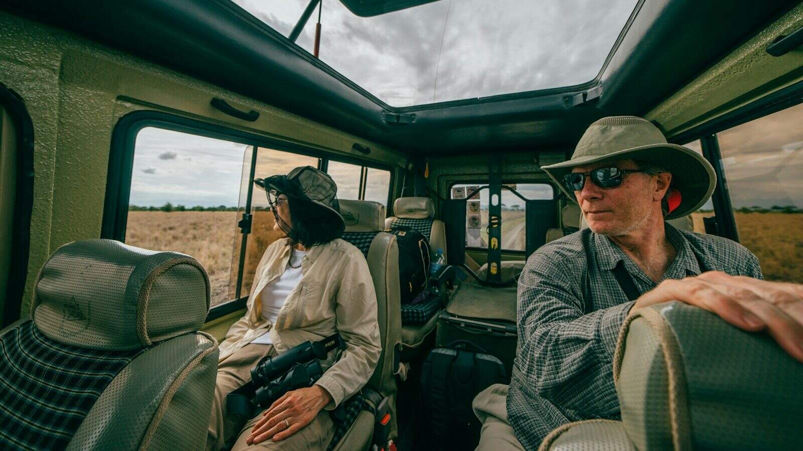 man and woman sitting inside car
