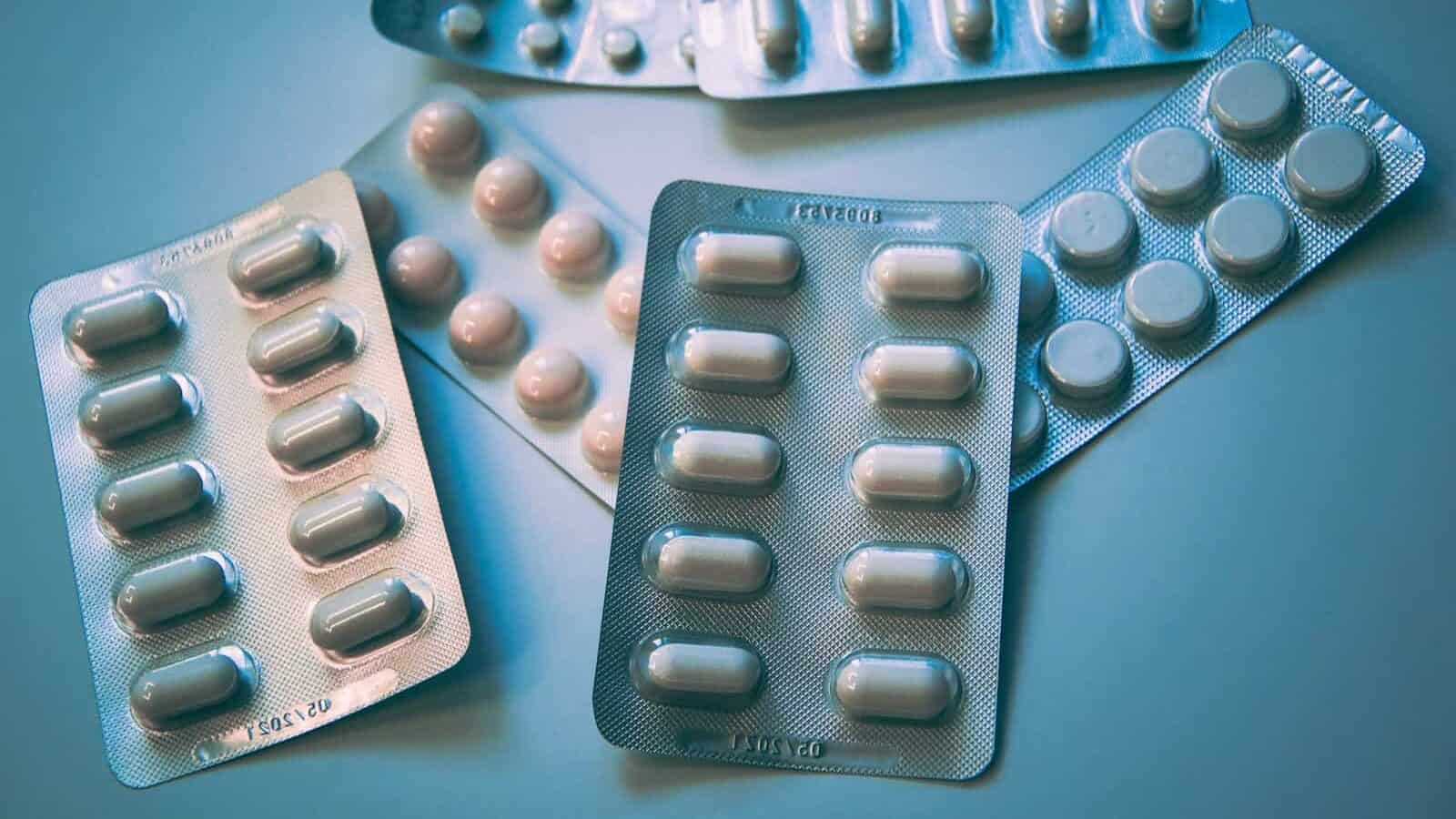 white and blue medication pill blister pack