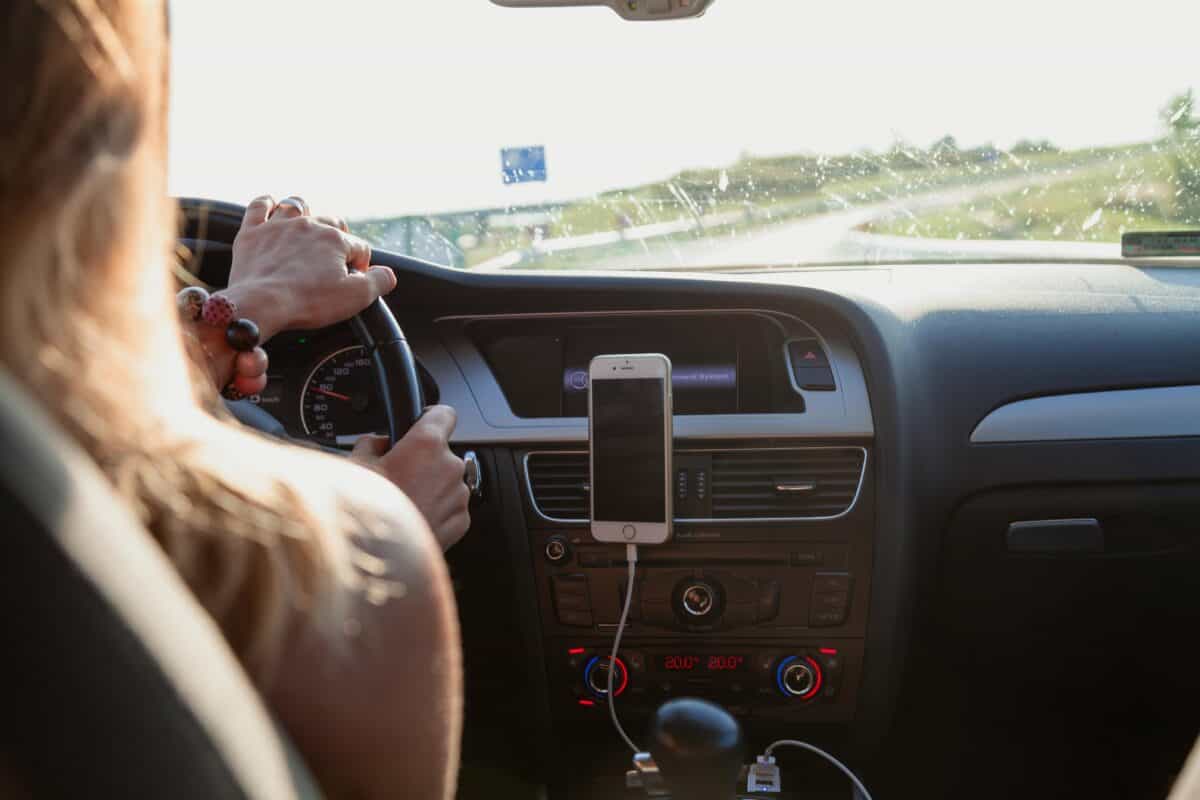A lady driver behind the steering wheel.