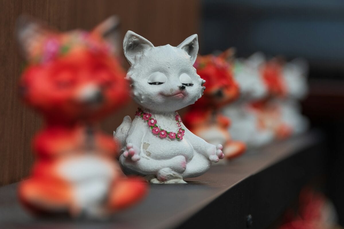 A group of small figurines sitting on top of a shelf