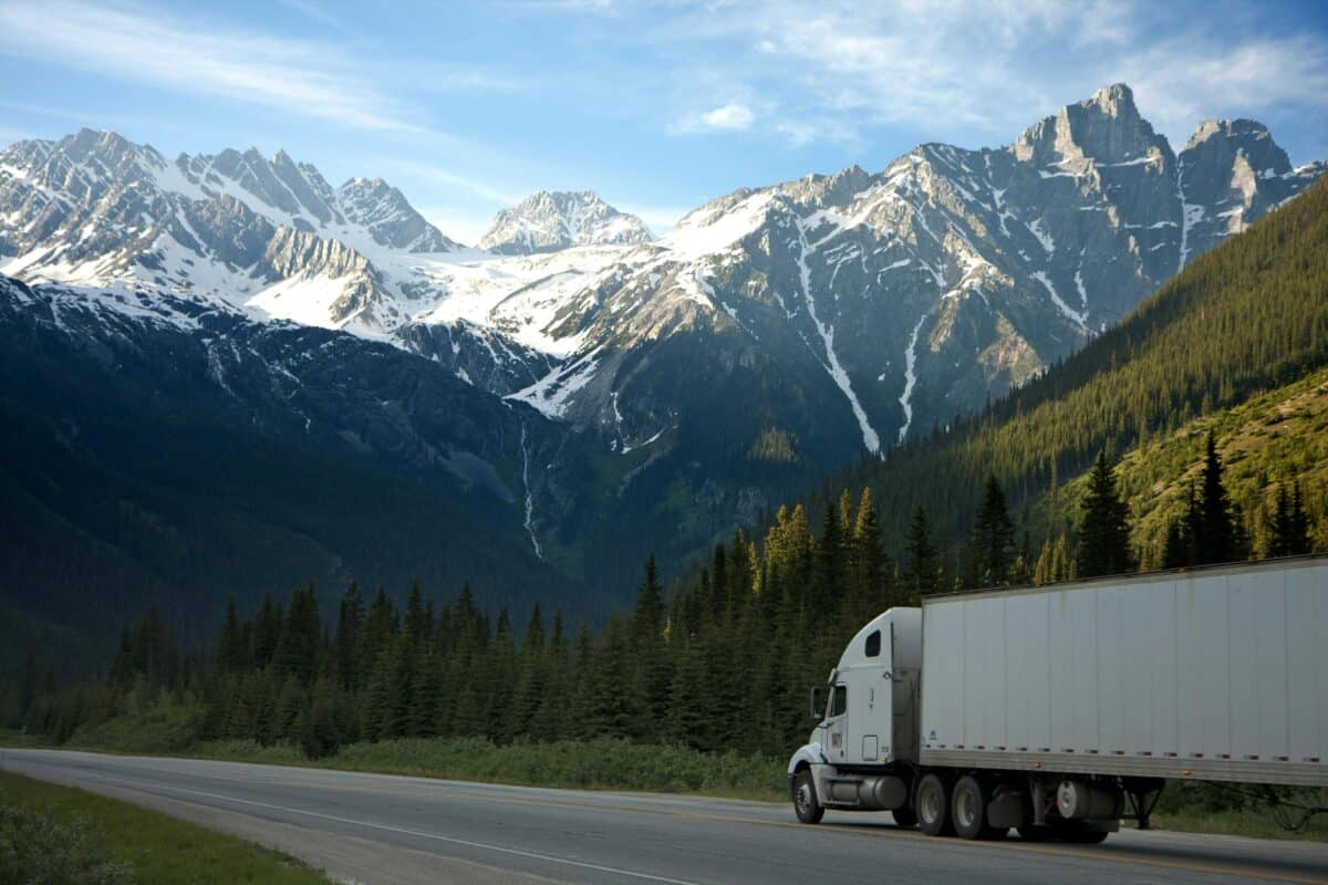 A truck traversing a mountainous road.