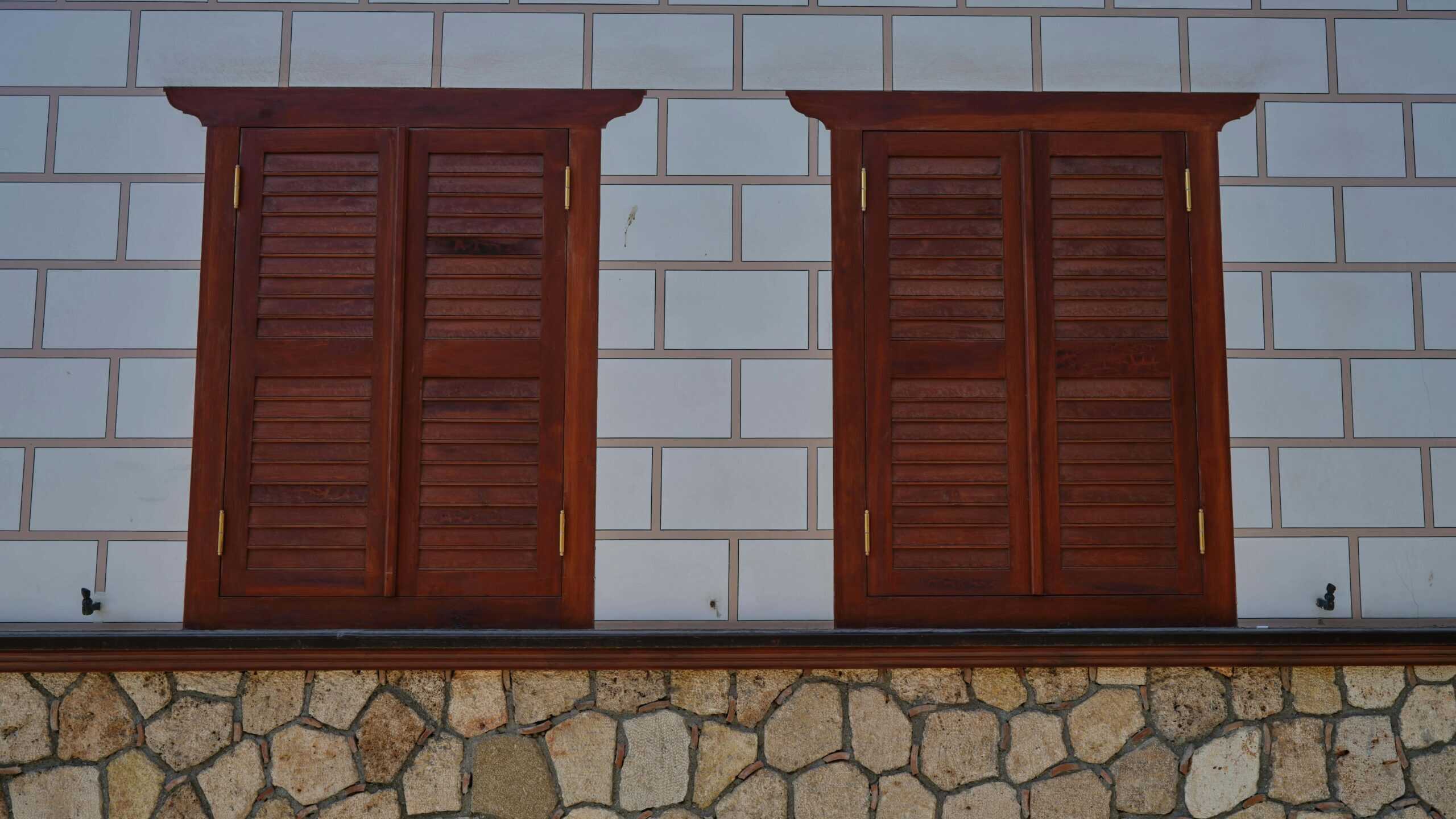 A photo of wooden windows closed.