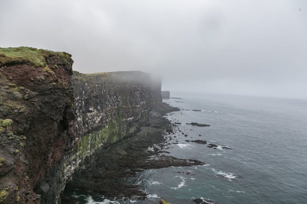 Mysterious-looking cliff surrounded by fog