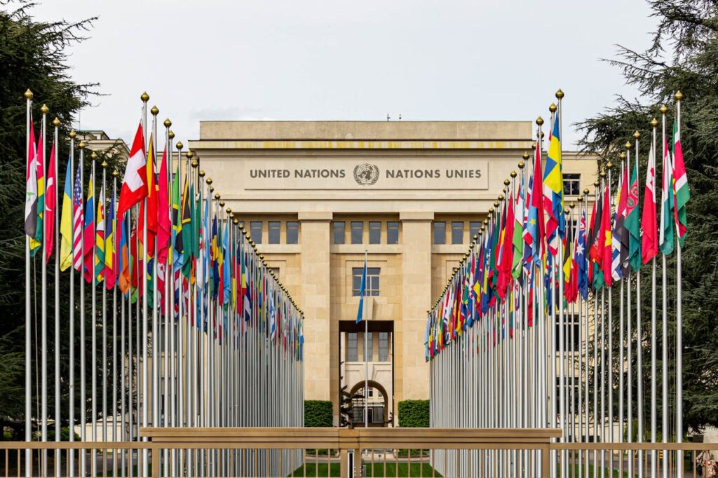 flags of member nations in front of the United Nations Office