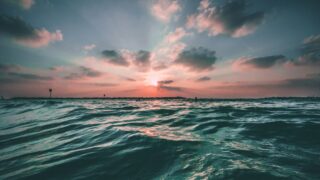 body of water during golden hour